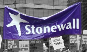 A Stonewall UK flag in a monochrome backdrop.