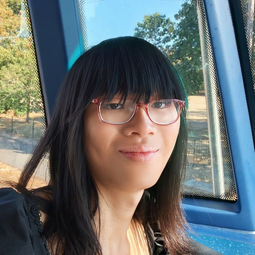 Kristina's picture is a selfie on a bus (one of her favourite places to be!) She has dark brown straight hair and is wearing glasses, looking directly at the camera